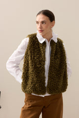 Model wearing Forest Green faux sheepskin gilet by Helen Moore