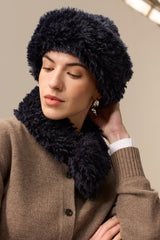 Model wearing a Navy Blue faux sheepskin Sherpa Hat by Helen Moore