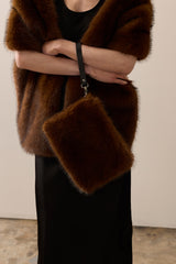 Model wearing a Mahogany faux fur Stole and matching Clutch Bag by Helen Moore