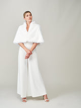 Model wearing the Whisper White faux fur bridal cape by Helen Moore