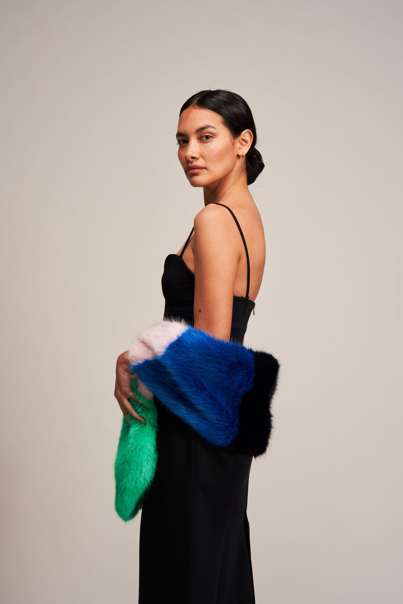 Model wearing a a Multi Vixen faux fur scarf by Helen Moore in blue, pink and green.