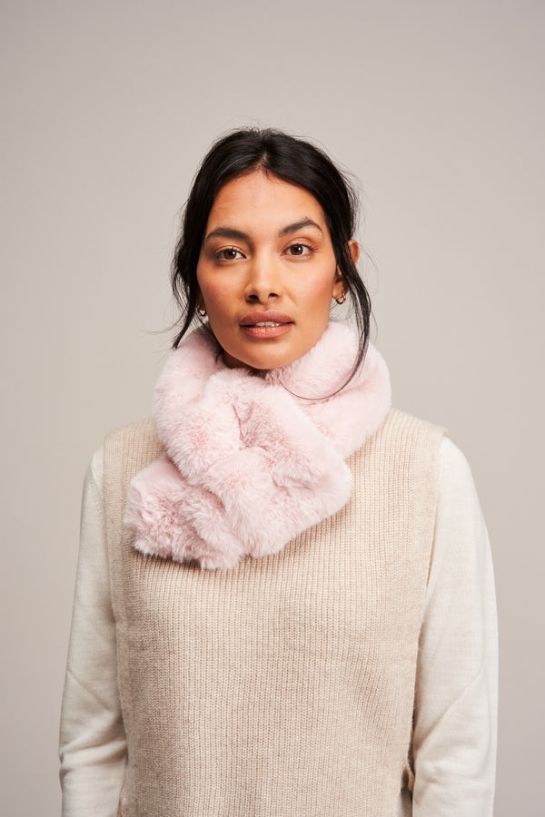 Model wearing a Blossom pink faux fur Ruffle Scarf by Helen Moore