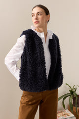 Model wearing Navy faux sheepskin gilet by Helen Moore
