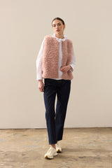 Model wearing Rose faux sheepskin gilet by Helen Moore