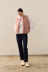 Model wearing Rose faux sheepskin gilet by Helen Moore