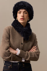 Model wearing a Navy Blue faux sheepskin Sherpa Hat by Helen Moore