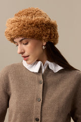 Model wearing a mid brown faux sheepskin Sherpa Hat by Helen Moore