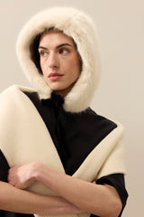 Model wearing Ermine faux fur hood with ribbon tie by Helen Moore