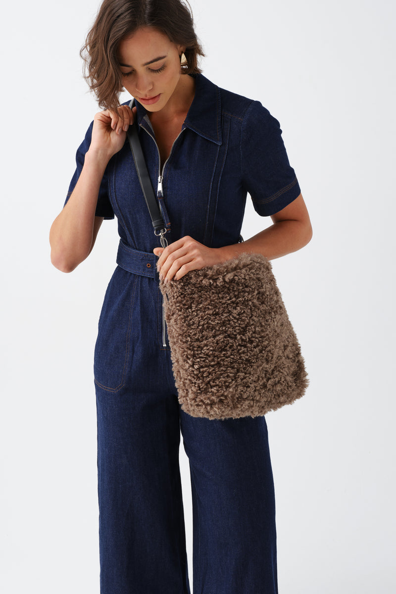 Model holding a Taupe faux sheepskin Barrel Tote Bag by Helen Moore