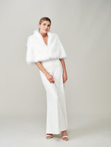 Model wearing the Whisper White faux fur bridal cape by Helen Moore