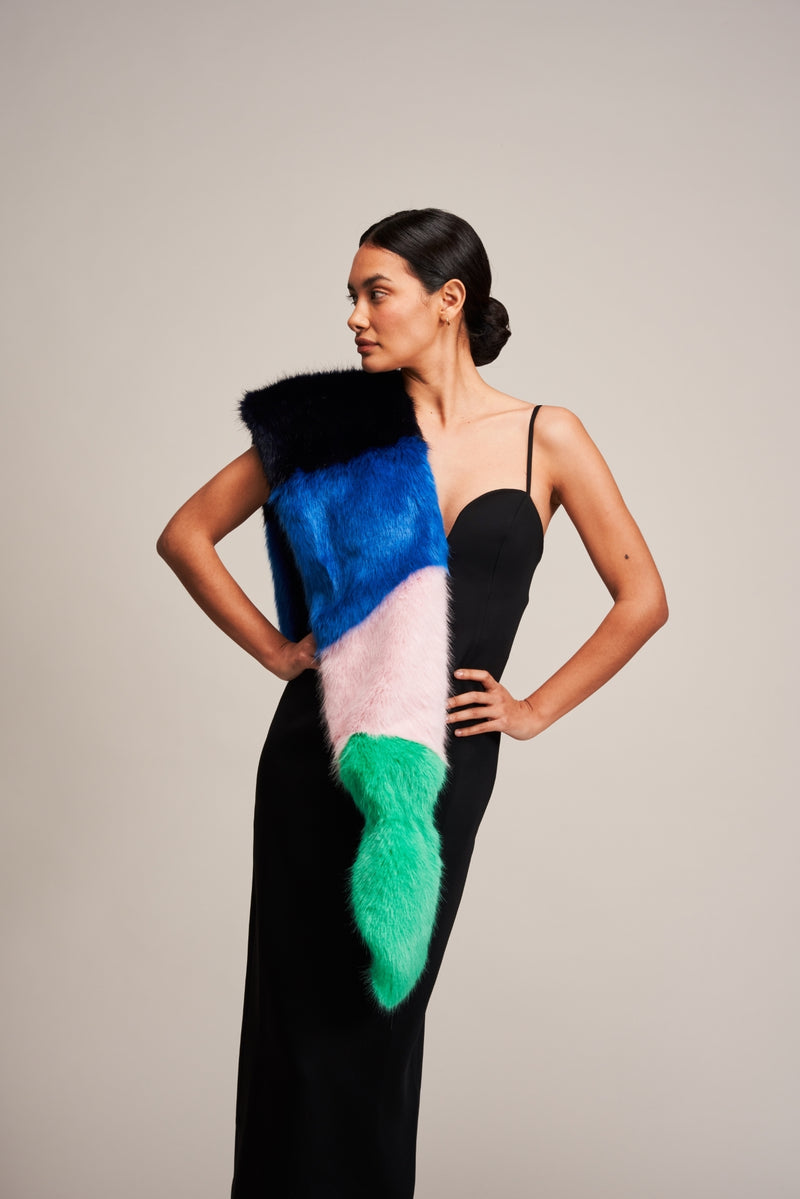 Model wearing a Multi Vixen faux fur scarf by Helen Moore in blue, pink and green.