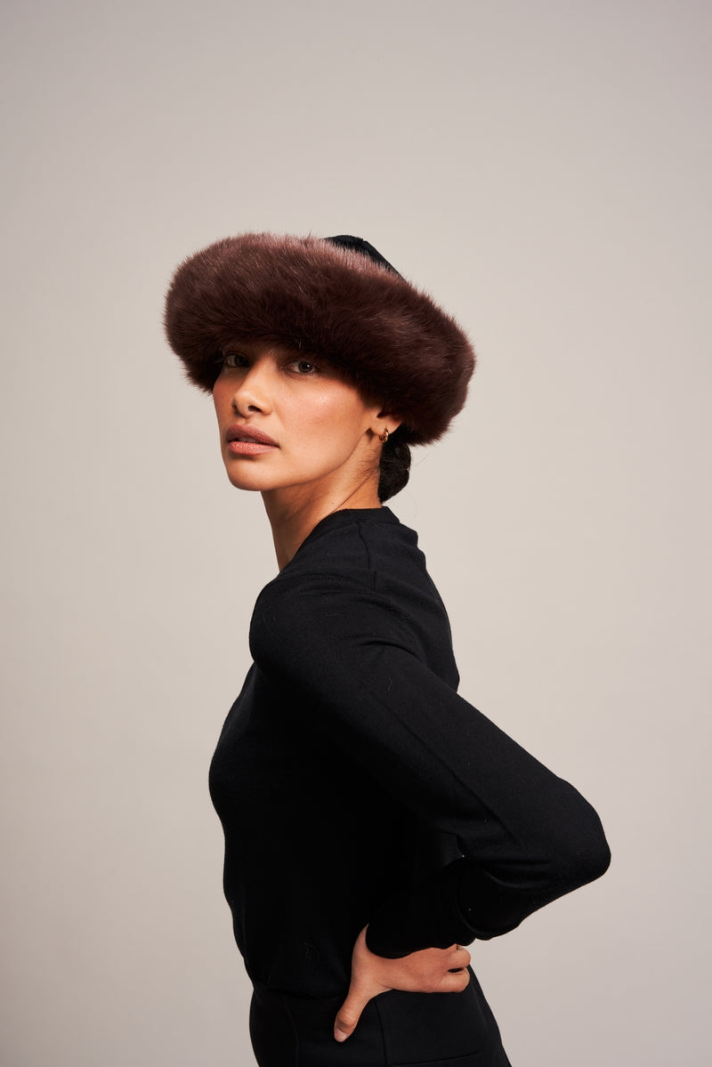 Model wearing a Conker Brown faux fur Brim Hat by Helen Moore