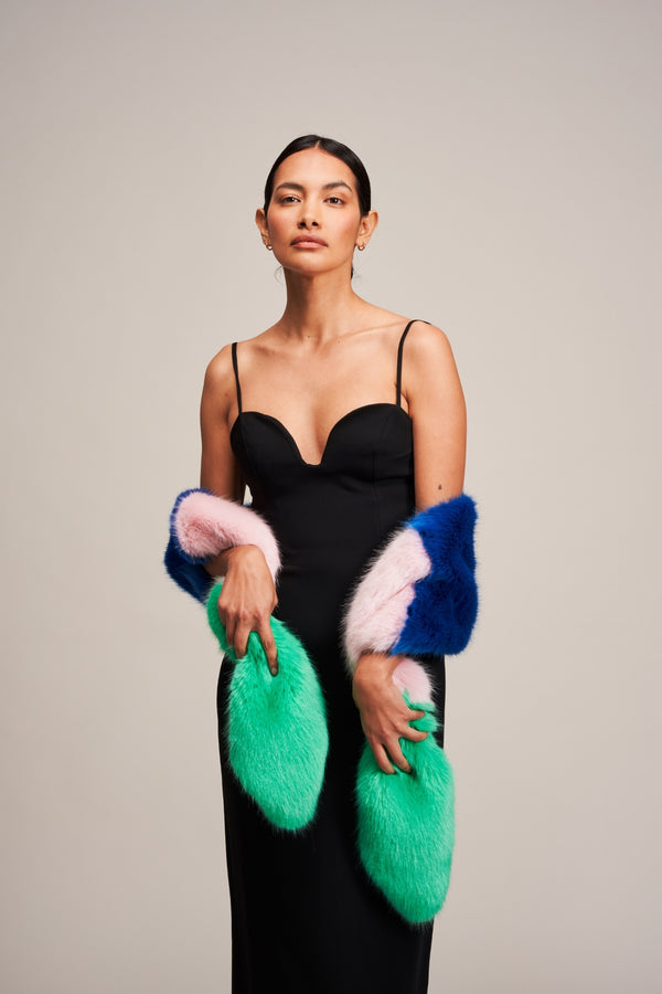 Model wearing a Multi Vixen faux fur scarf by Helen Moore in blue, pink and green.