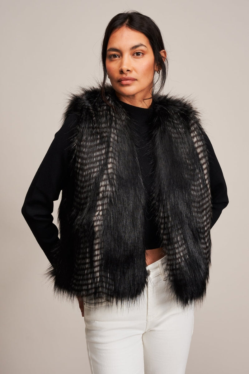 Model wearing a faux fur gilet in Black Quail by Helen Moore