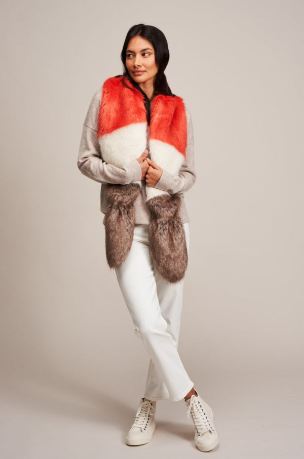 Model wearing a Multi Vixen faux fur scarf by Helen Moore in coral, cream and brown.