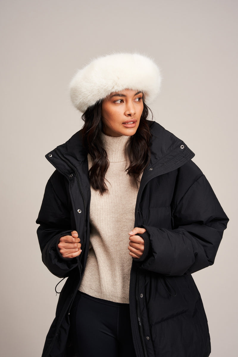 Model wearing an Ermine white faux fur Brim Hat by Helen Moore