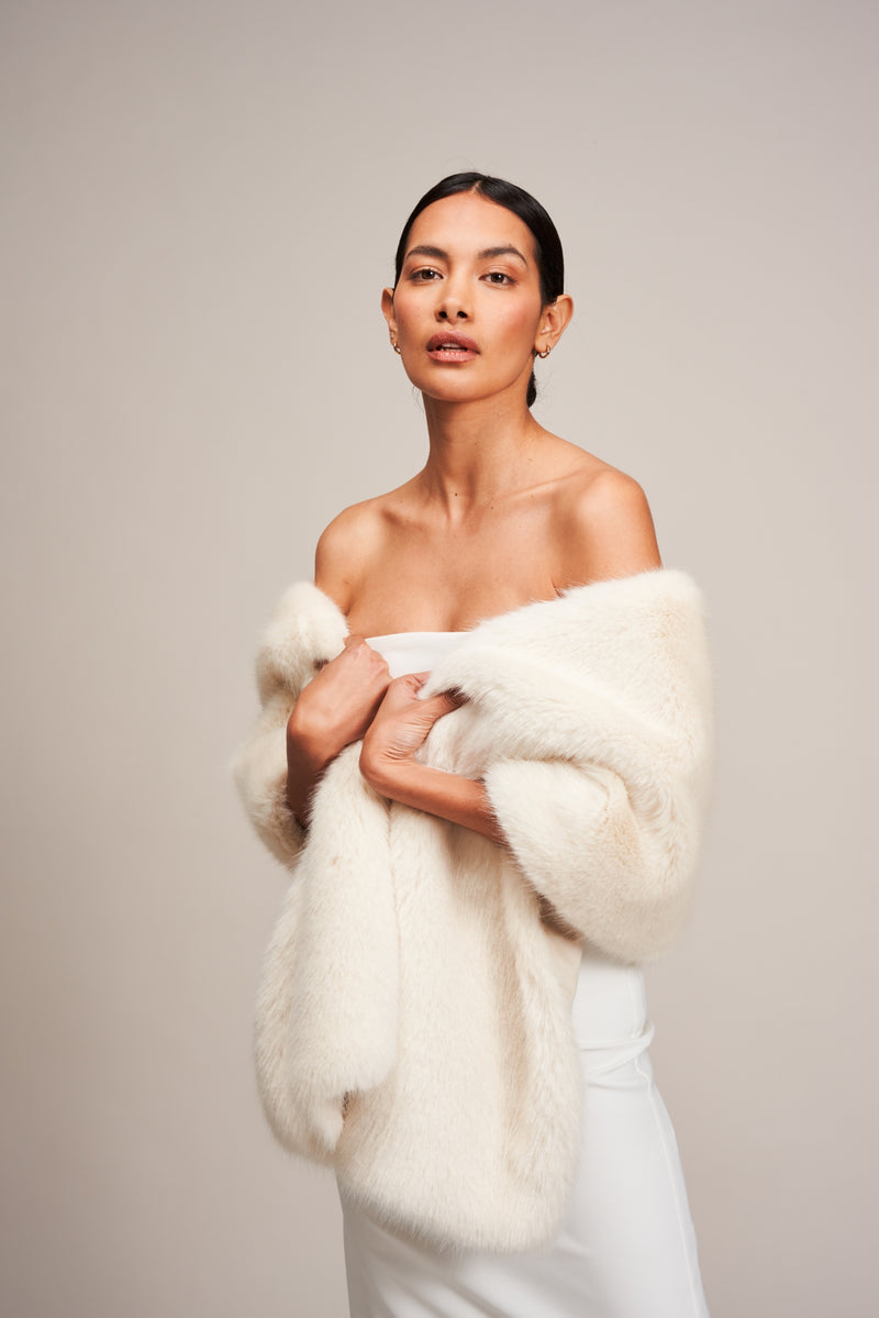 Model wearing Ermine white Stole Cover Up by Helen Moore