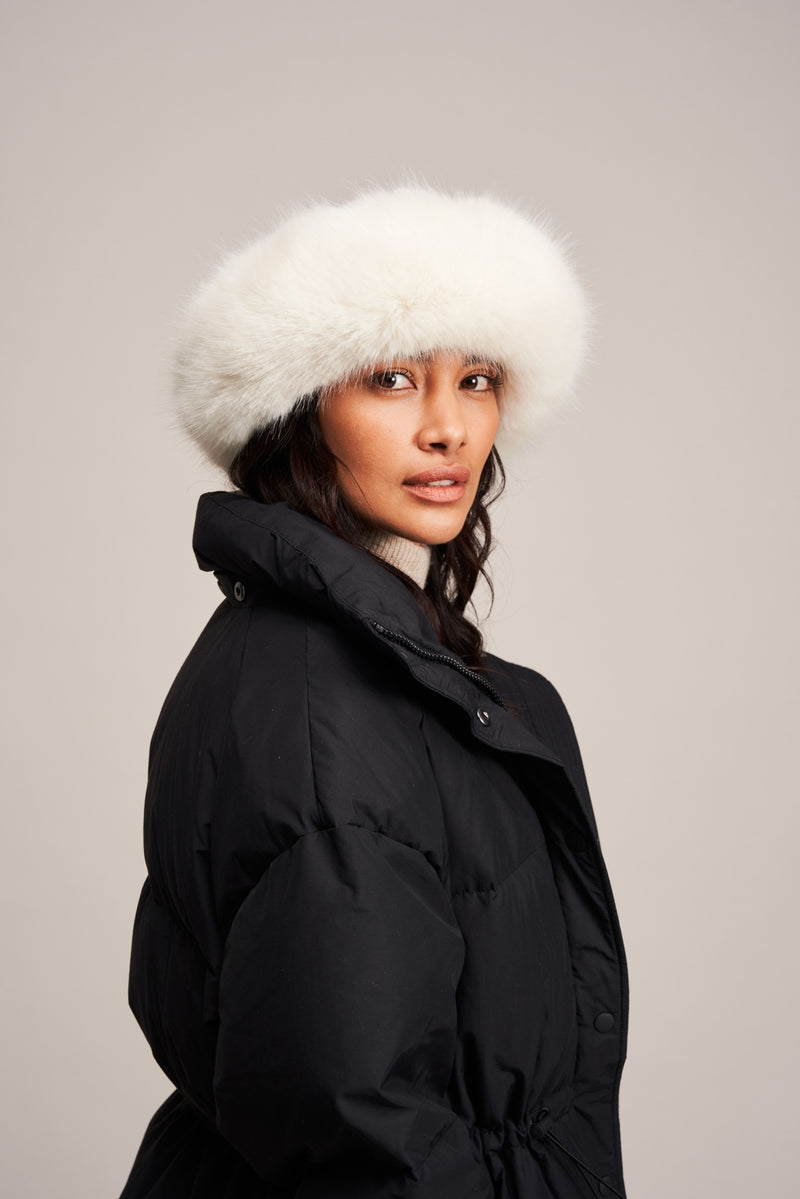 Model wearing an Ermine white faux fur Brim Hat by Helen Moore