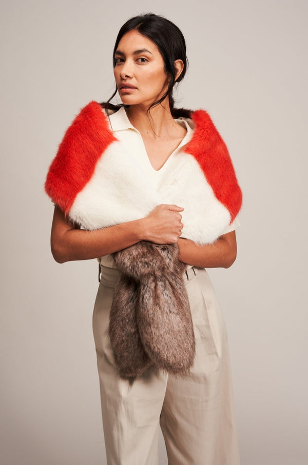 Model wearing a Multi Vixen faux fur scarf by Helen Moore in coral, cream and brown.