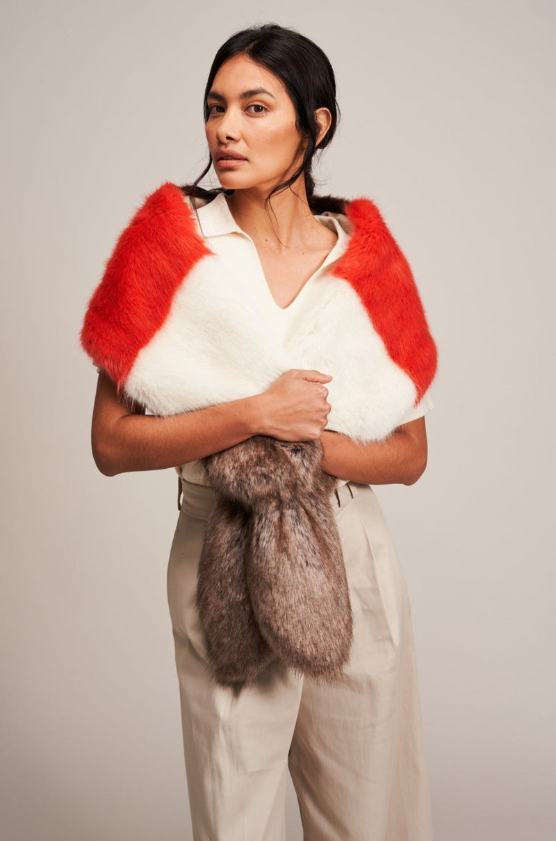 Model wearing a Multi Vixen faux fur scarf by Helen Moore in coral, cream and brown.