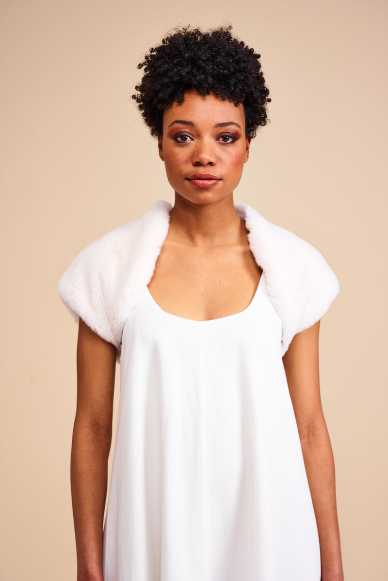 Model wearing white faux fur bolero by Helen Moore called Orchid