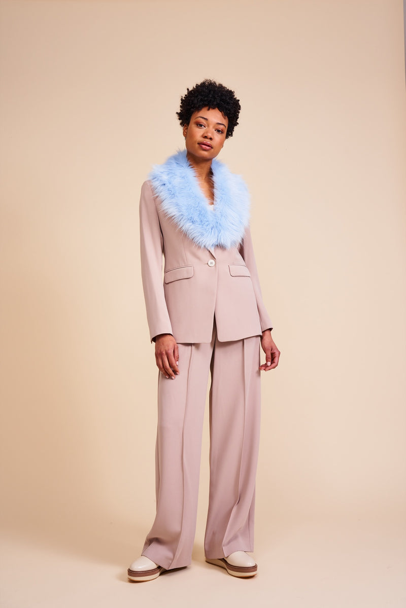 Model wearing a light blue faux fur collar by Helen Moore, called the Darcy Collar
