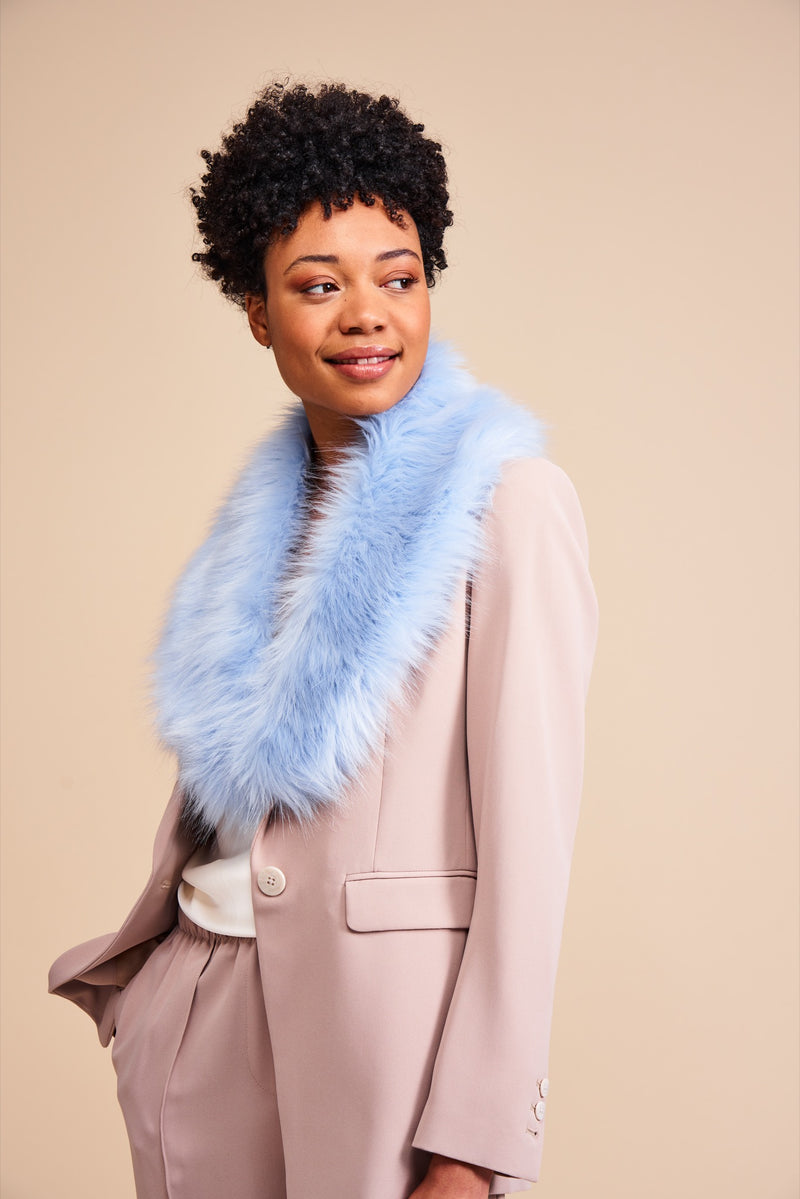Model wearing a light blue faux fur collar by Helen Moore, called the Darcy Collar