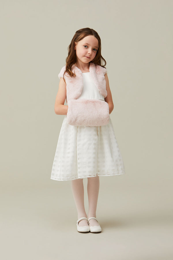 Child model holding children's light pink faux fur hand muff by Helen Moore