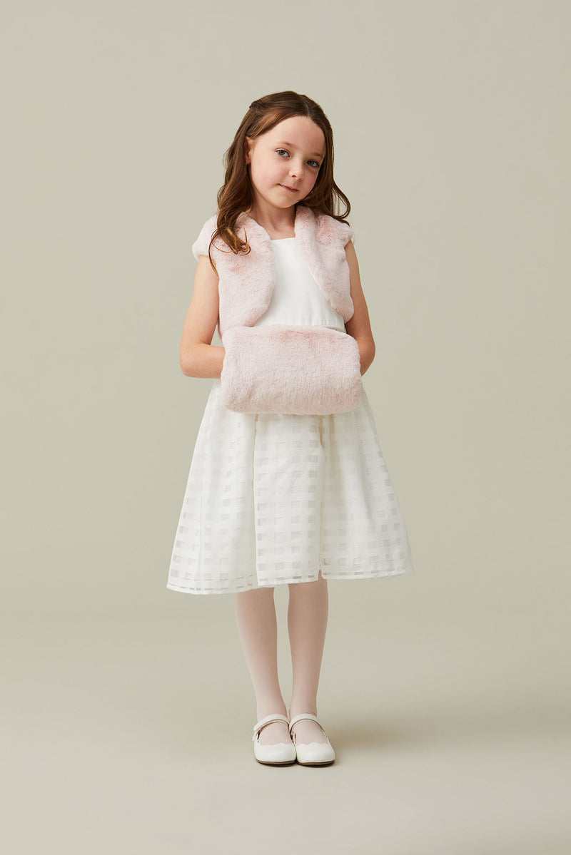 Child model holding children's light pink faux fur hand muff by Helen Moore
