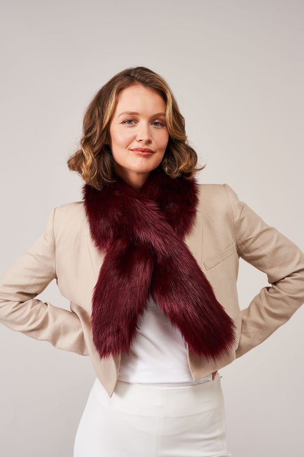 Model wearing a Burgundy faux fur Crisscross scarf by Helen Moore