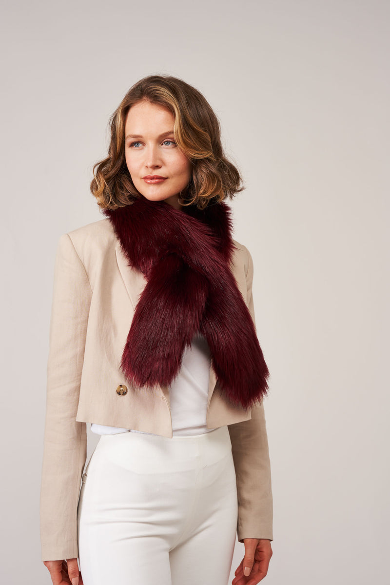 Model wearing a Burgundy faux fur Crisscross scarf by Helen Moore